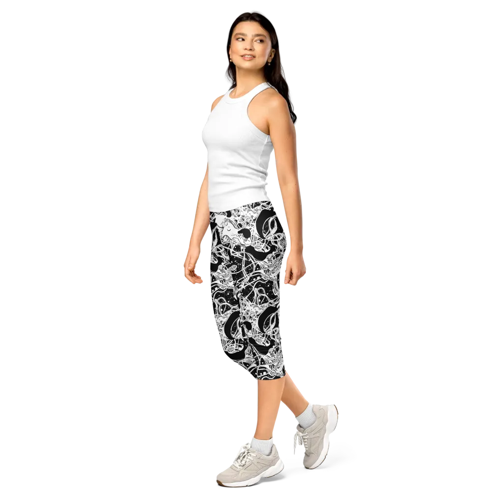 Chaos in Black on Capri Leggings — Left Front